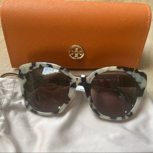 Tory Burch sunglasses that are tortoise in the front frame & maroon on the sides